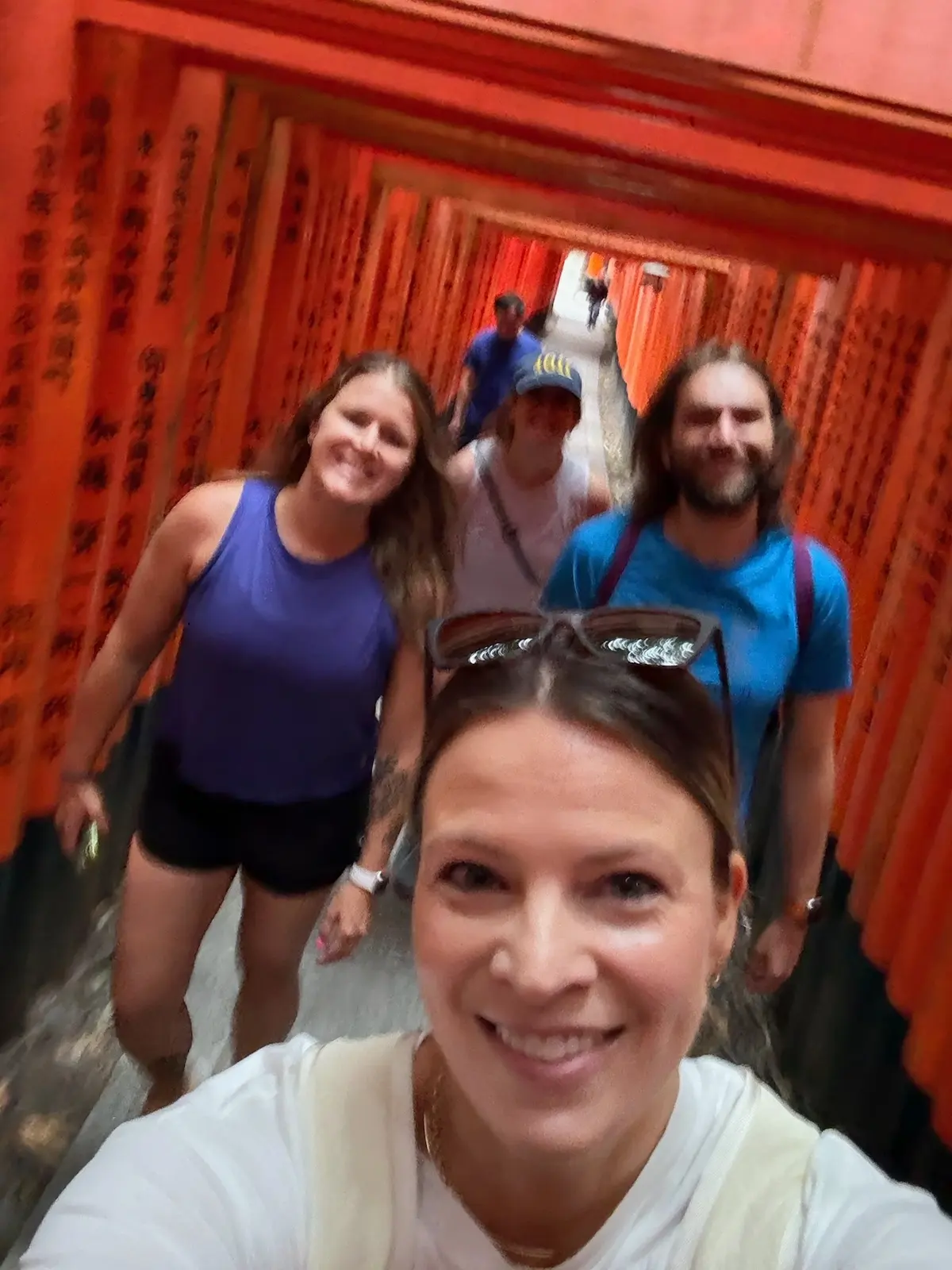 Group selfie under the torii gates at Fushimi Inari.