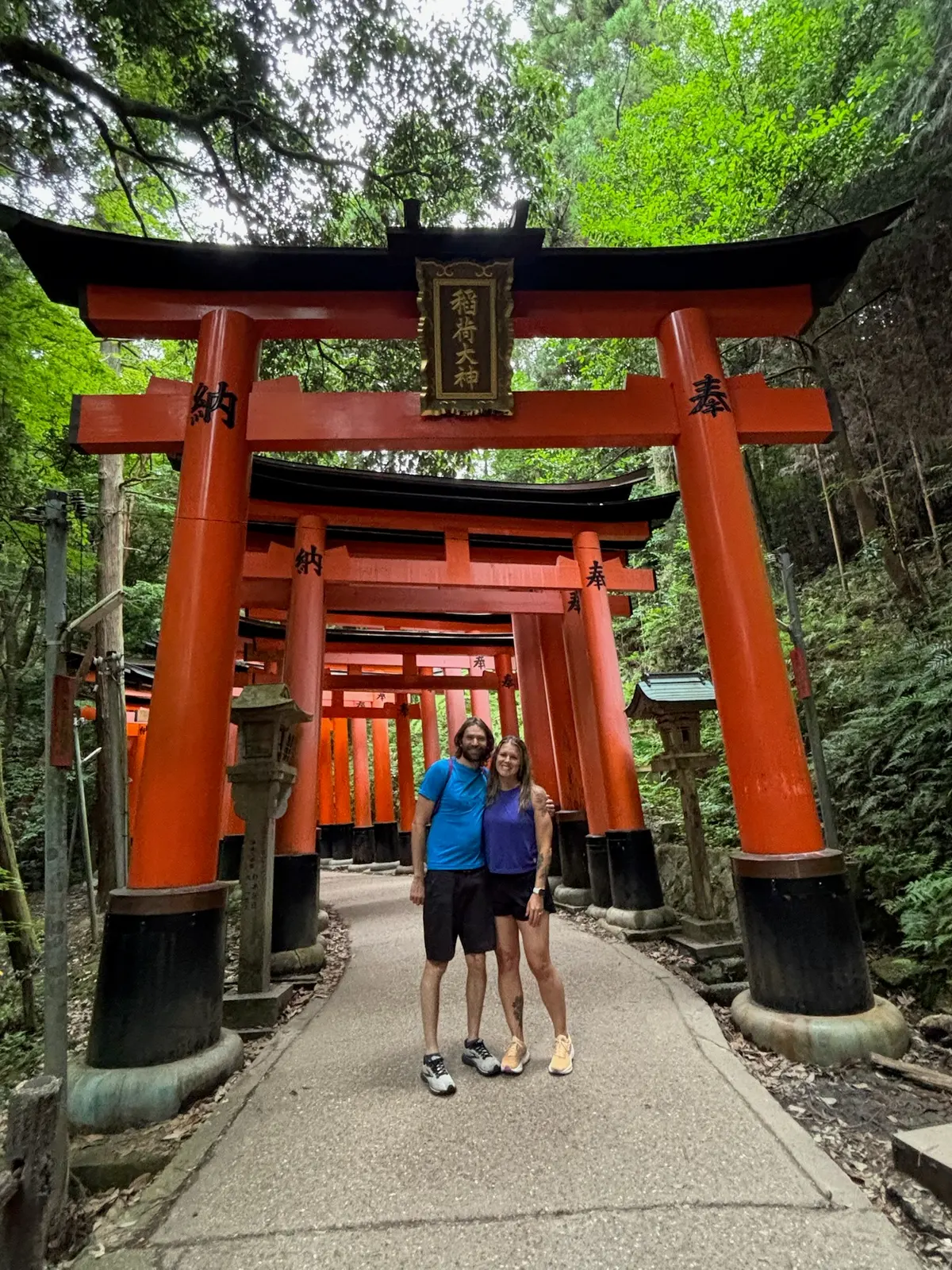 Group photo under torii gates at Fushimi Inari.