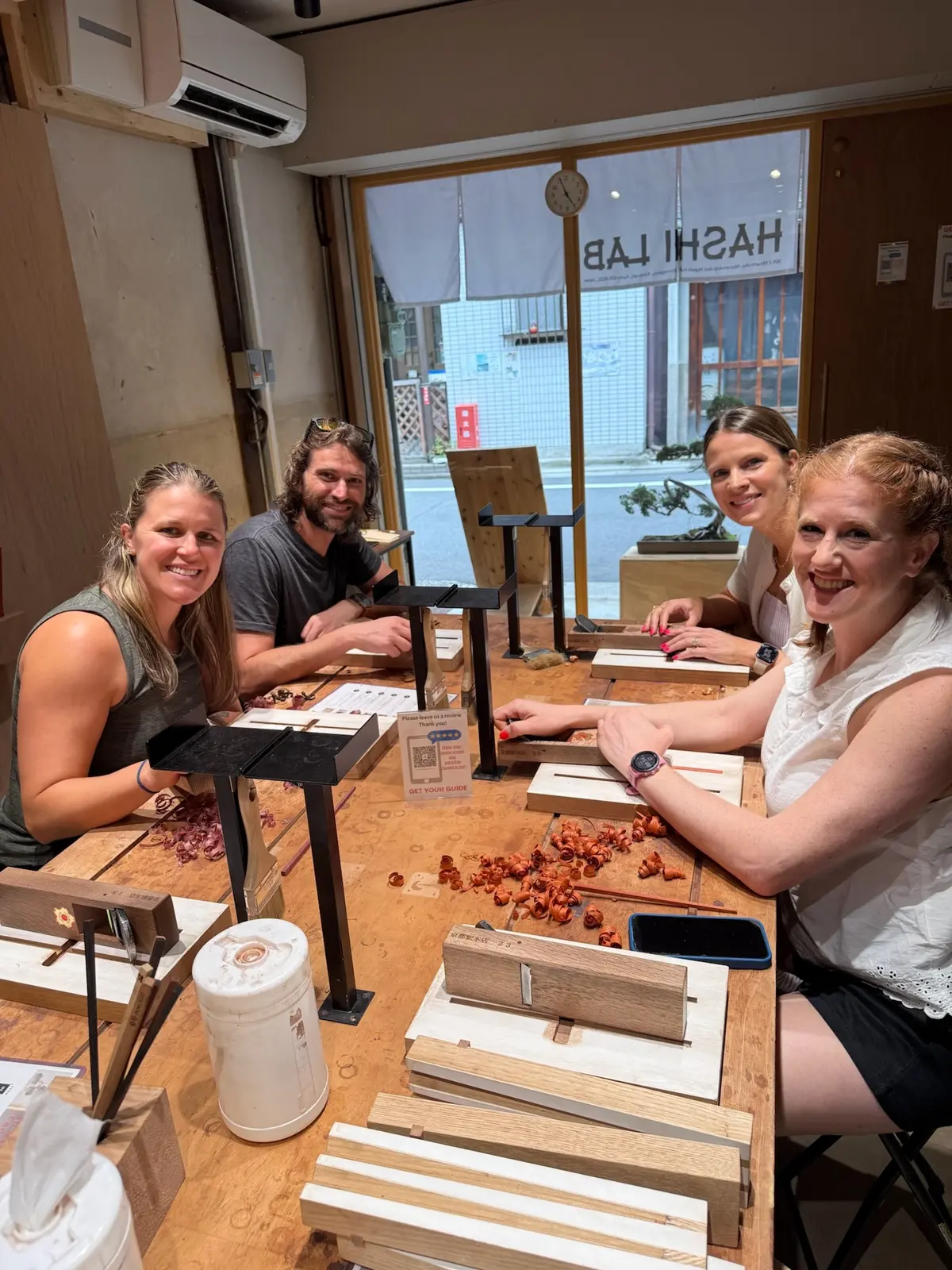 The group sitting at a table during the Hashi Lab chopstick workshop.