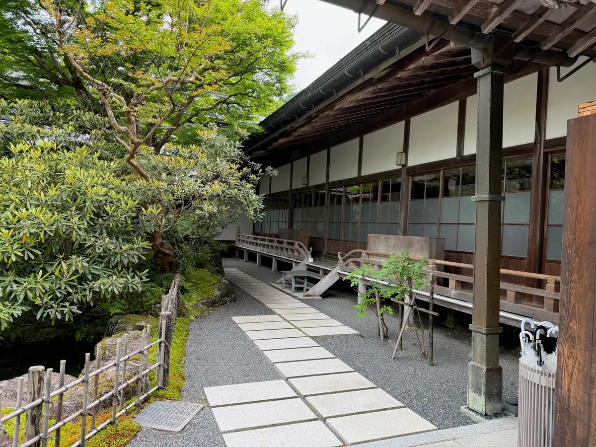 Stone walkway and wooden temple building in Koyasan.