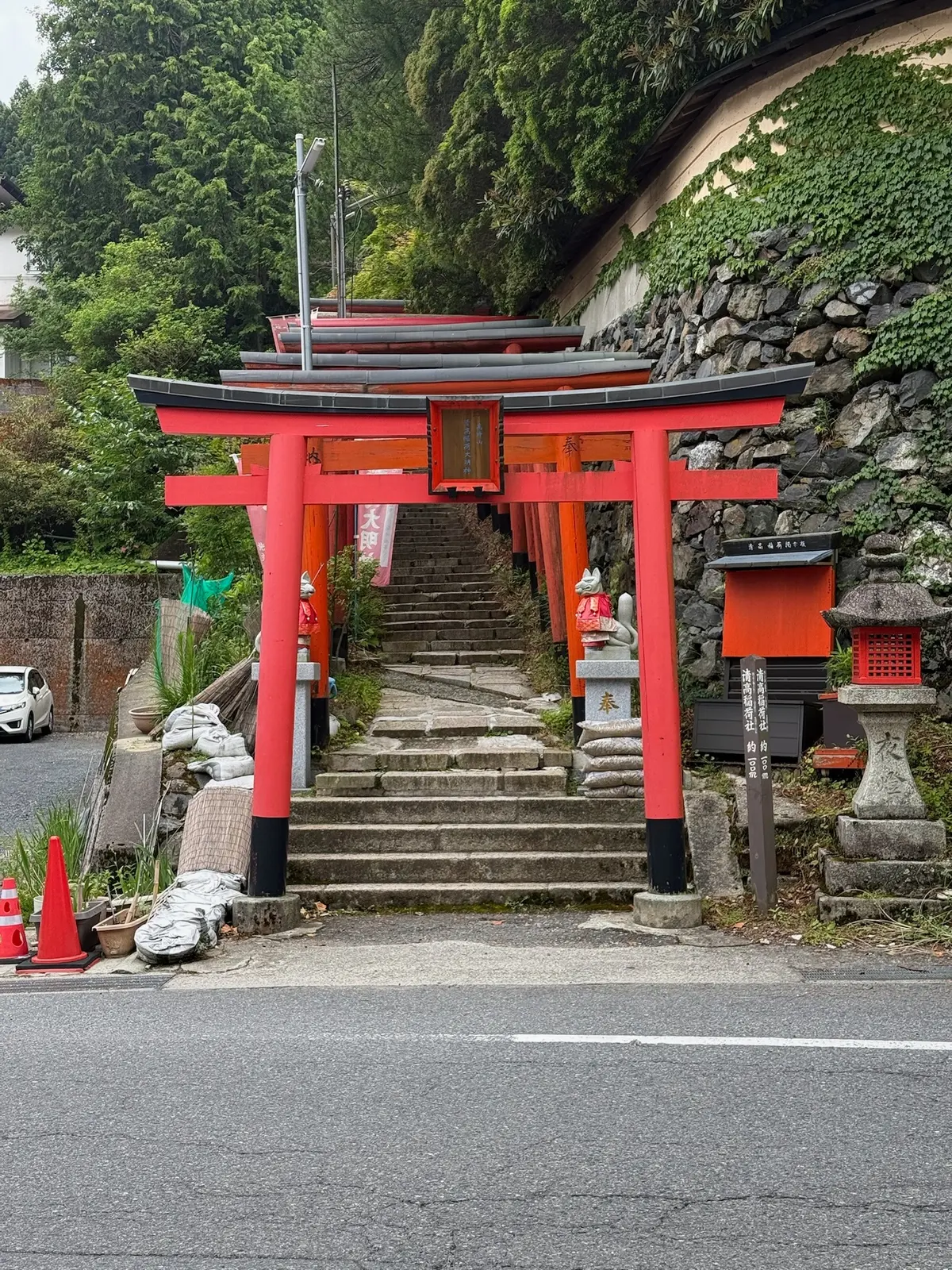 A red torii gate near a stairway in Koyasan.