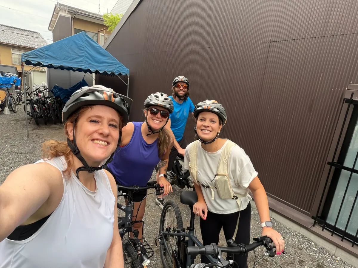 The group wearing helmets on the Kyoto e-bike tour.