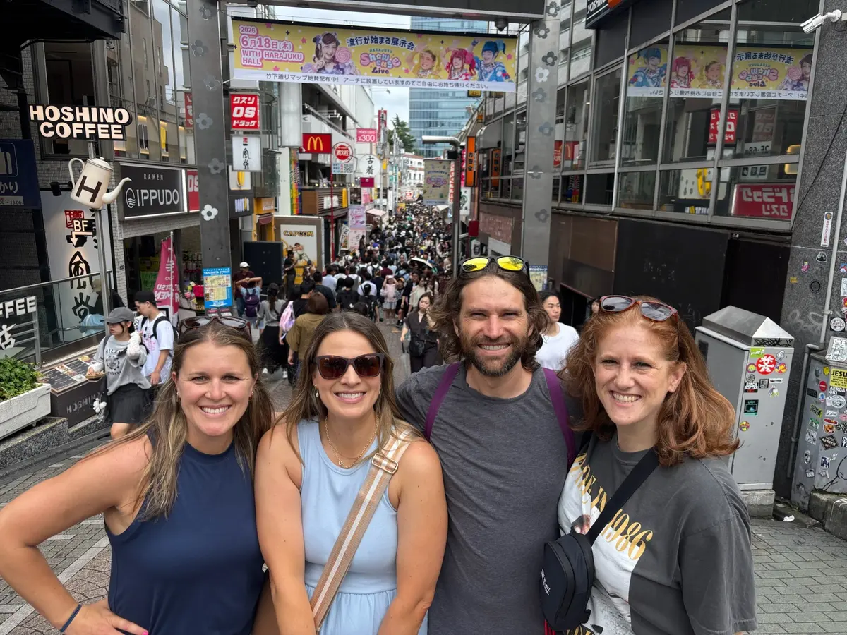 Group selfie on a busy Shibuya street.