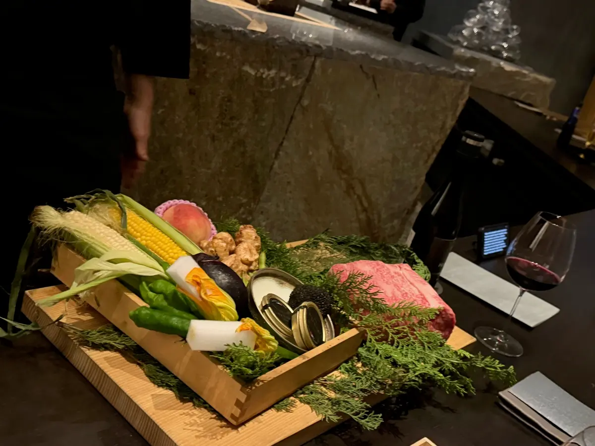 Wagyu beef and vegetables displayed before cooking in Osaka.