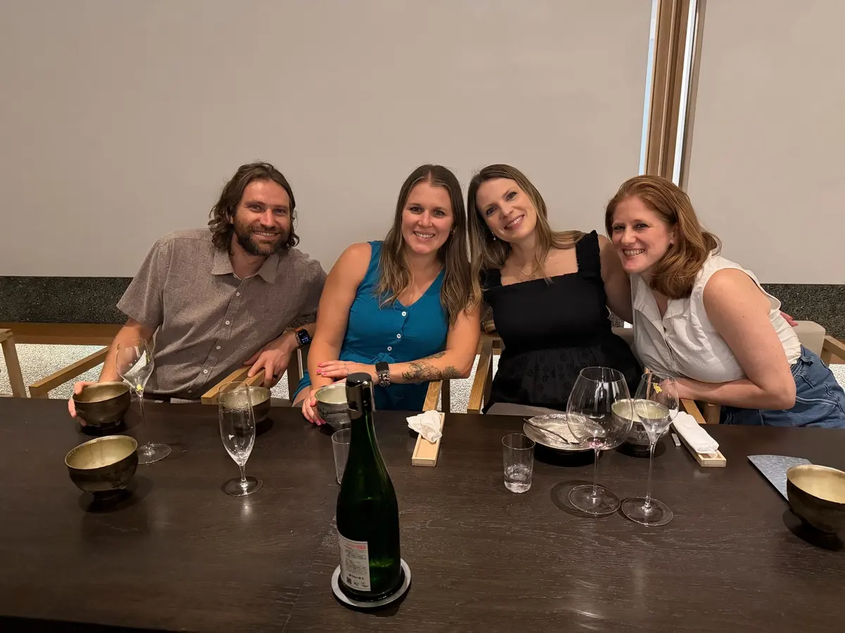 Zach, Caitlin, Sarah, and Ashley seated together at the wagyu dinner.